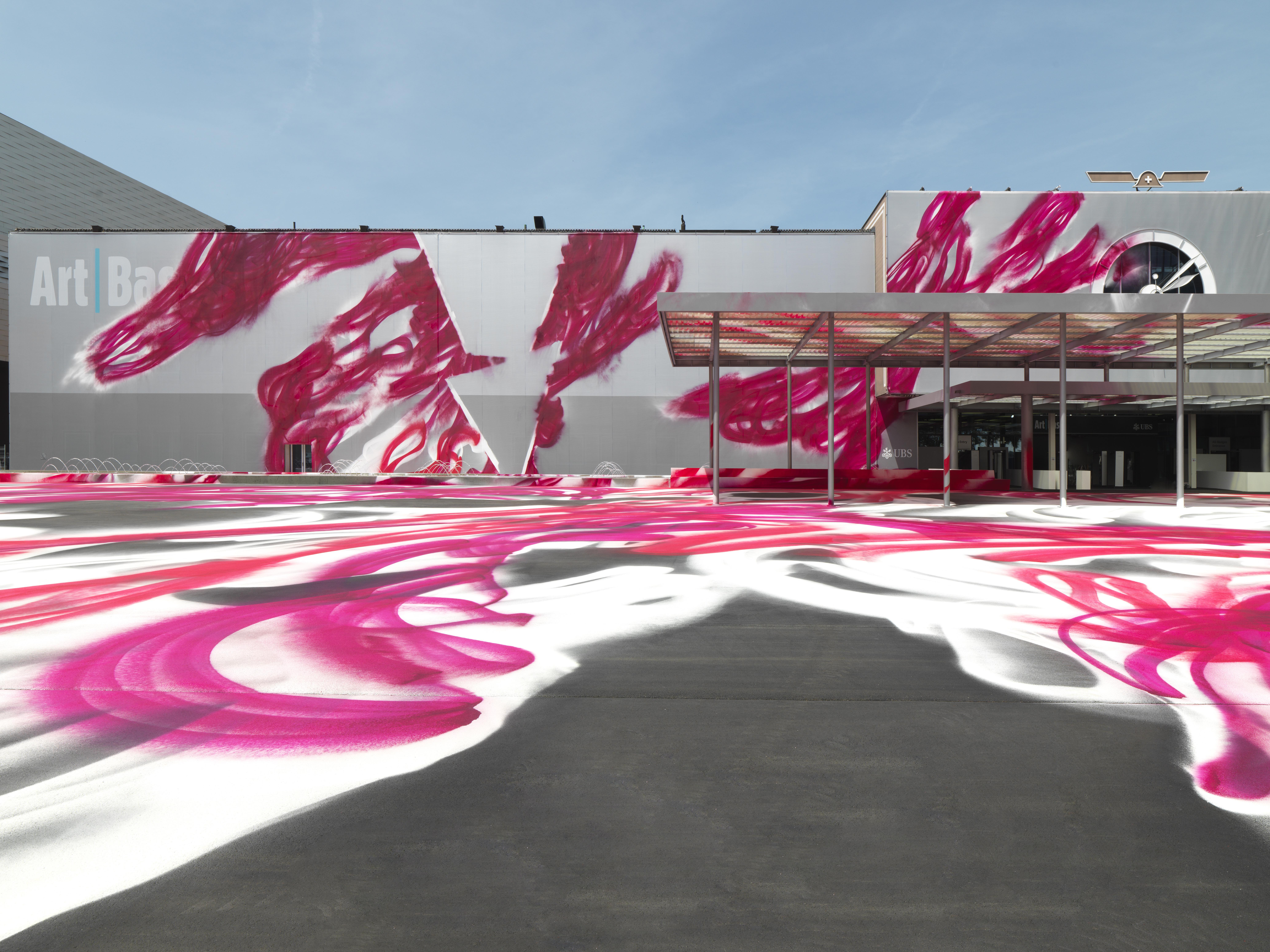 Katharina Grosse, CHOIR, 2025, Messeplatz project, Art Basel, Acrylic on asphalt, fabric 16 x 91 x 55 mCourtesy: the artist (c) VG Bild-Kunst, Bonn 2025Photograph: Jens Ziehe